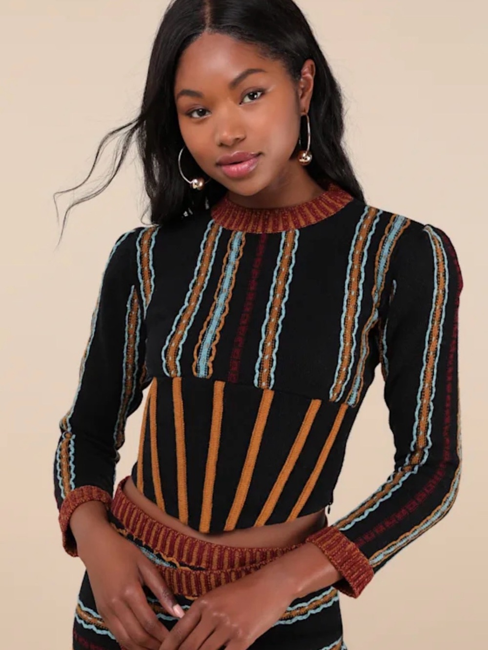 Mutma Striped Knit Long-Sleeve Crop Top in Black and Rust.